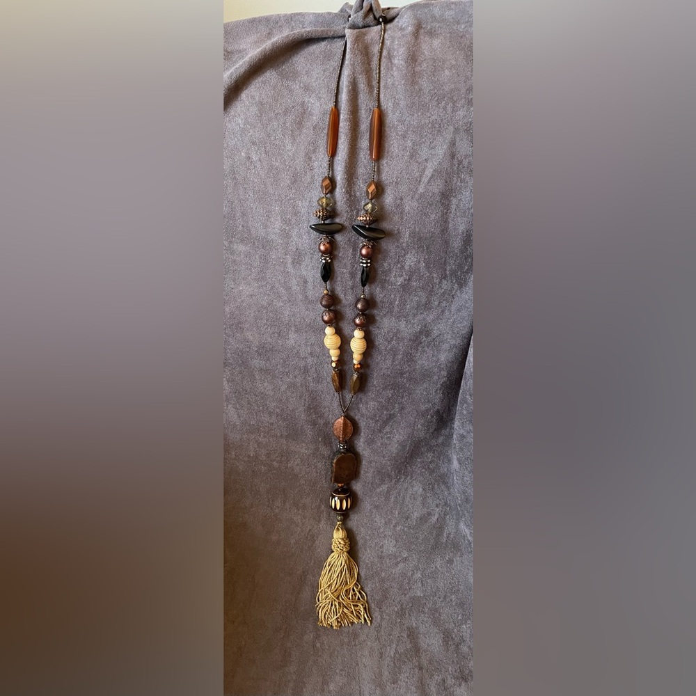 Long beaded necklace with tassel pendant